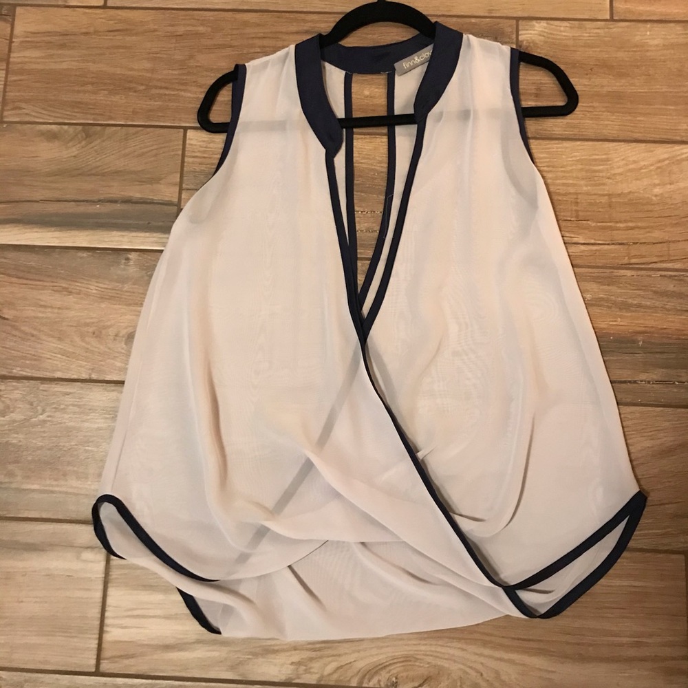 Light blue/gray sleeveless blouse with navy trim